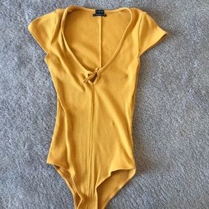 Never worn, yellow bodysuit from Urban outfitters